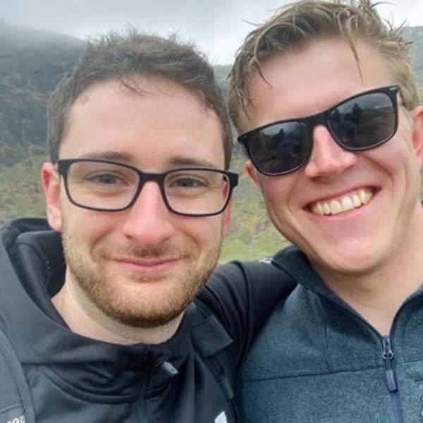 Mark and his friend looking happy before their walk begins.